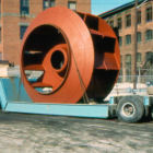 Large rotor leaving on a drop-bed trailer