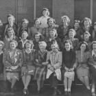 Wartime woman workers gathered outside the building.